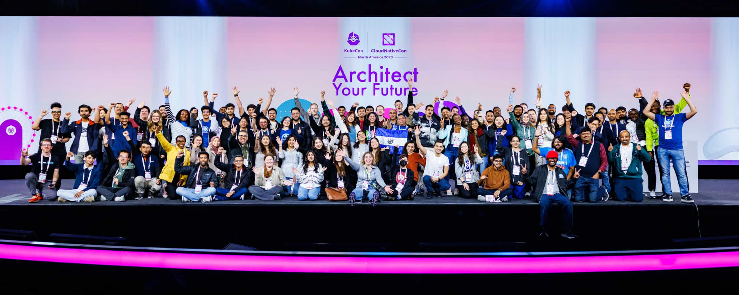 Diversity group on stage cheering at Kubecon NA